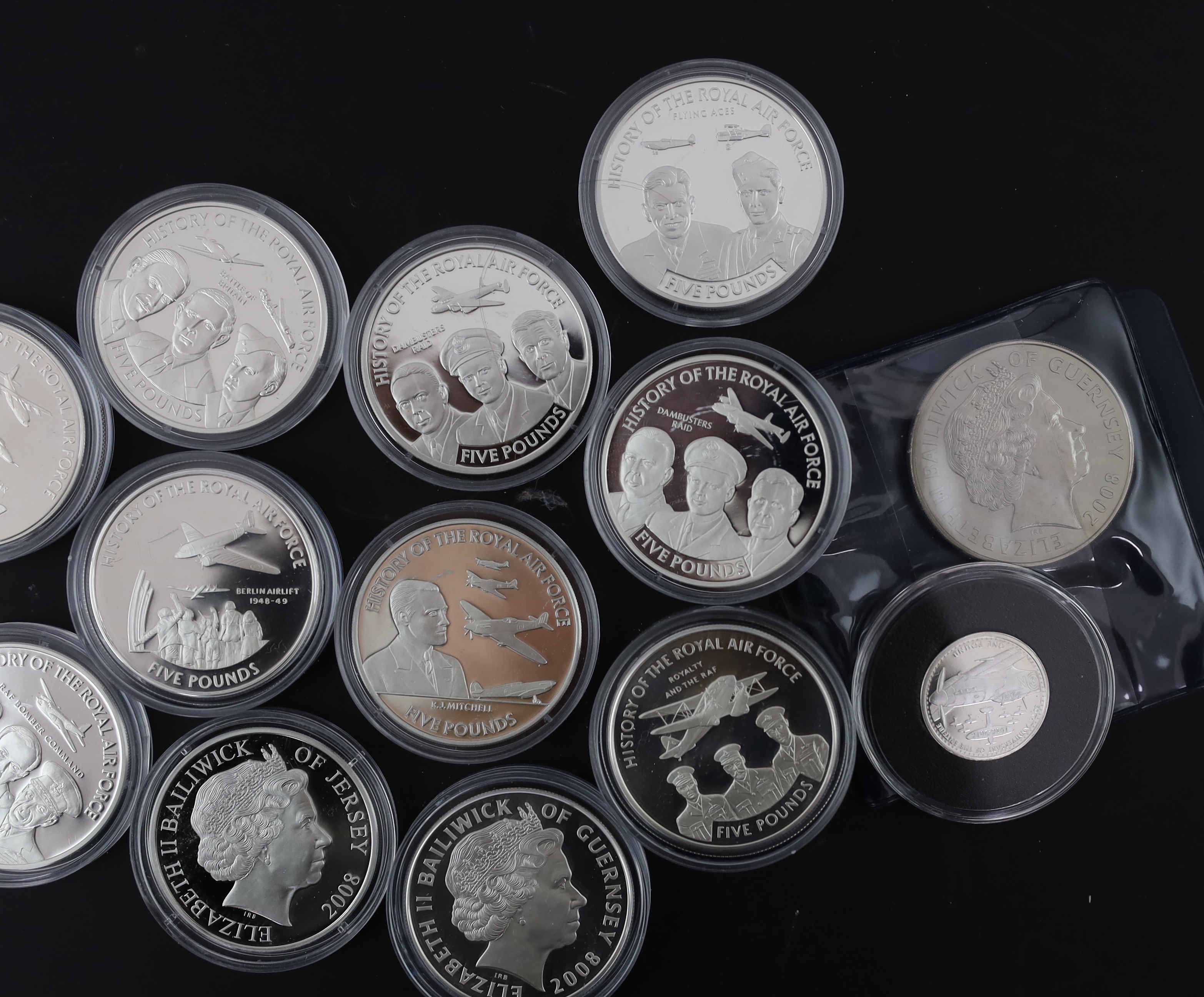 Bailiwick of Jersey and Guernsey coins, Elizabeth II, 13 History of the RAF proof silver £5 coins, 2008, a similar cupronickel coin and a Tristan da Cunha proof silver 80th anniversary Spitfire £1 coin (15)